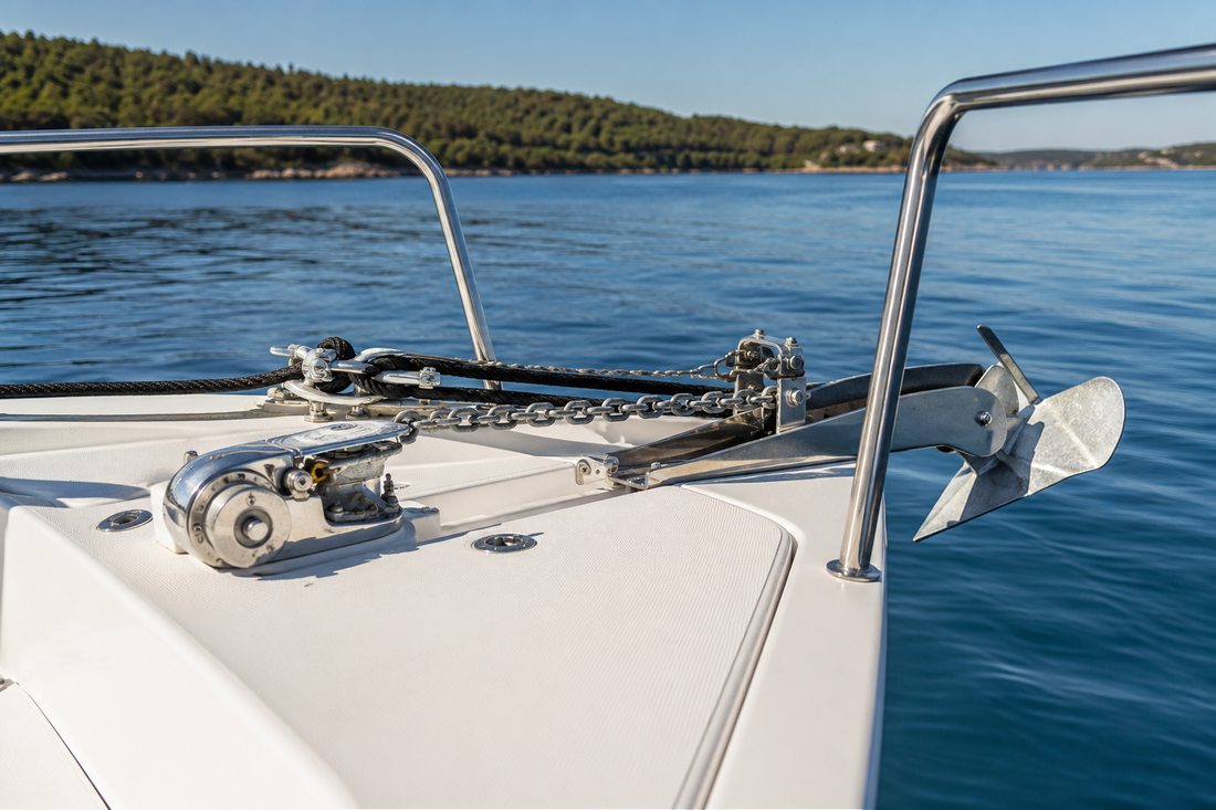 Boat anchor, chain and rope rode secured at the bow of a recreational boat